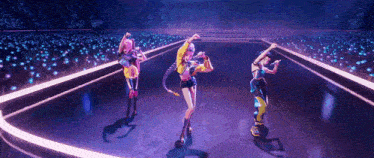 three women are dancing on a stage in front of a crowd of people .