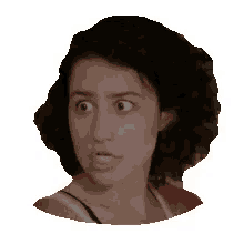 a woman with curly hair is making a surprised face .