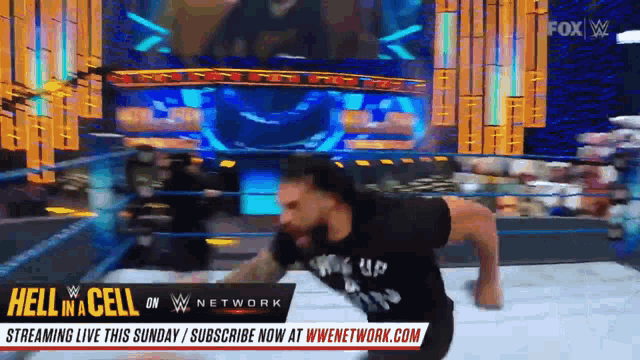 a man in a wrestling ring with the words hell in the cell on the bottom