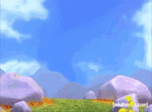 a pink teddy bear is standing in a field with rocks and flowers