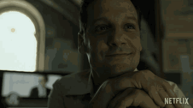 a close up of a man 's face with the word netflix on the bottom