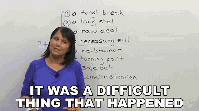 a woman stands in front of a whiteboard with the words " it was a difficult thing that happened "