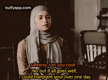 a woman wearing a hijab and scarf is talking to someone .
