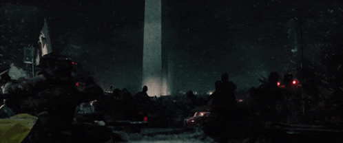 a group of people are gathered in front of a washington monument