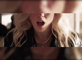 a close up of a woman 's face with the letter r on her neck