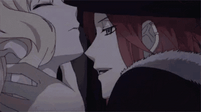 a close up of a person kissing another person 's neck .