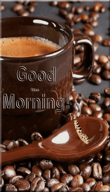 a cup of coffee is surrounded by coffee beans and a spoon with a butterfly on it