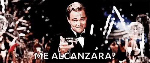 a man in a tuxedo is holding a gun in front of a crowd and says me alcanzara ?