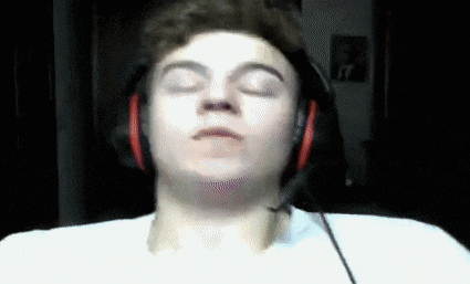 a man wearing headphones with a microphone on his neck