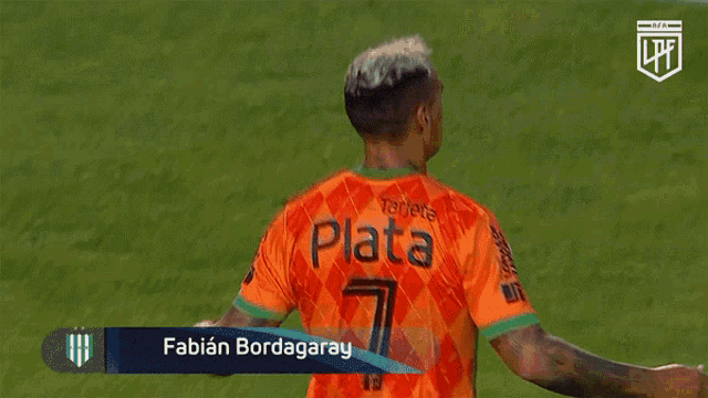 a soccer player named fabian bordagaray is hugging another soccer player