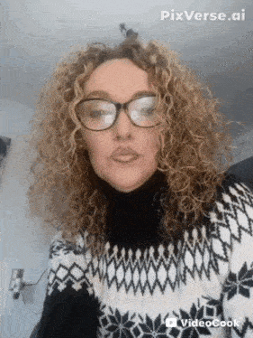 a woman with curly hair wearing glasses and a black and white sweater with pixverse.ai on the bottom