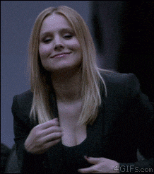 a woman in a black jacket is smiling with 4gifs.com at the bottom of the image