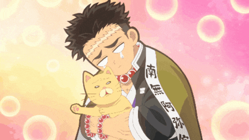a man holding a cat with chinese writing on his shirt
