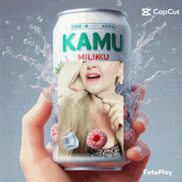 a hand is holding a can of kamu miliku drink