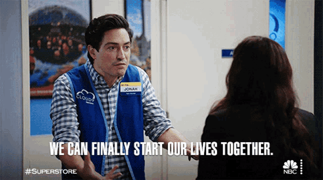 a man in a superstore vest talks to a woman and says we can finally start our lives together