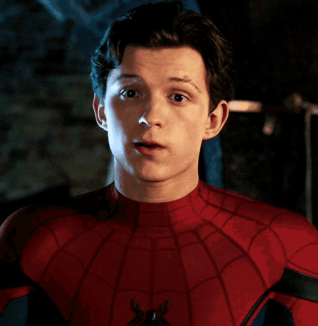 a close up of a man in a spider-man suit