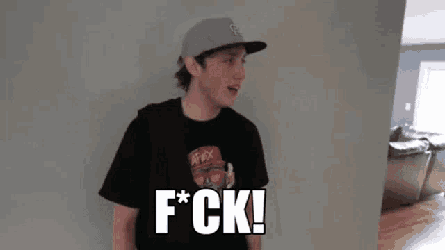 a young man wearing a hat and a t-shirt says f * ck