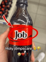 a person is holding a bottle of job coke