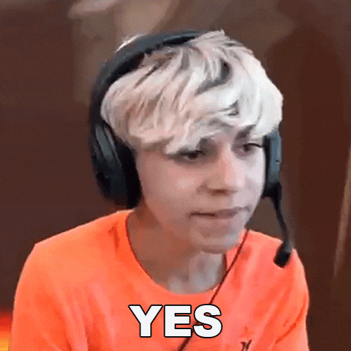 a young man wearing headphones and an orange shirt says yes