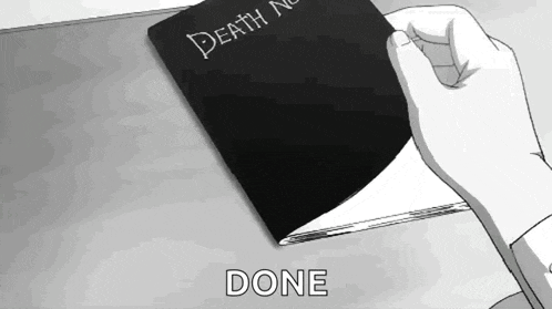 a person is holding a book that says " death note "