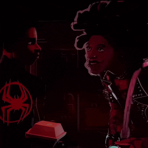 a man and a woman are standing next to each other with a spider on their jacket