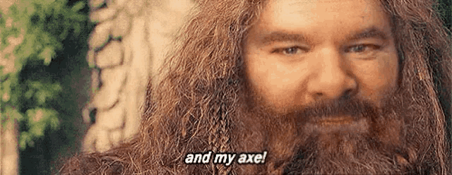 a close up of a man with a beard and the words `` and my axe '' .