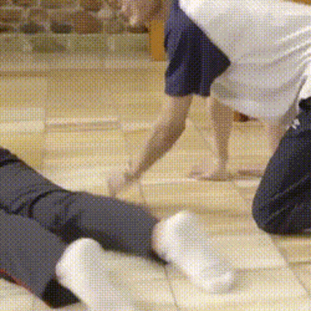 a person is laying on the floor with their legs crossed