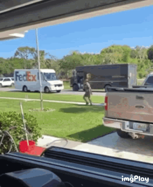 a fedex truck is parked on the side of a road