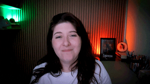 a woman making a face in front of a sign that says labyrinth