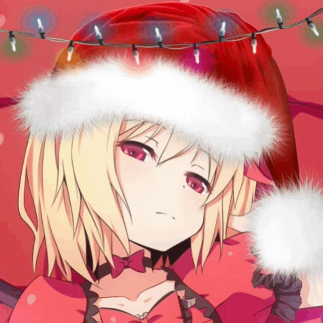 a girl wearing a santa hat with a string of lights behind her