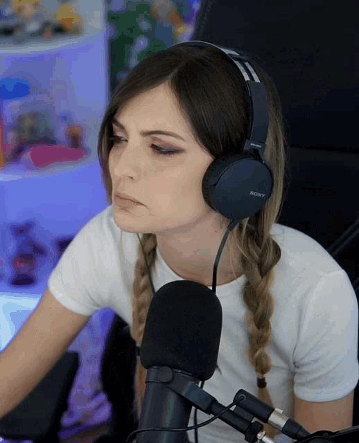 a woman wearing headphones that say sony on them