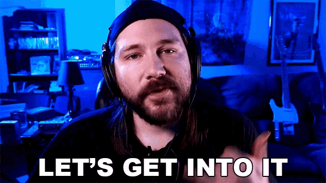 a man wearing headphones says let 's get into it in a video