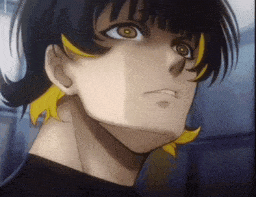 a close up of a man 's face with yellow hair