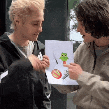 two men are looking at a drawing of a frog with a knife