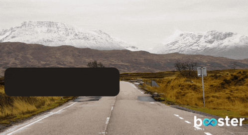 a road with mountains in the background and the word booster in the corner