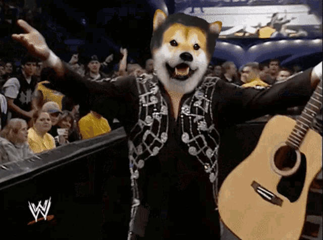 a man with a dog 's head is holding a guitar in front of a w logo