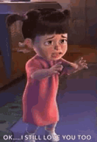 boo from monsters inc is crying while standing on the floor .