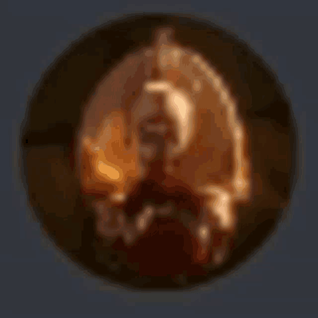 a blurred image of a person in a circle with a candle .