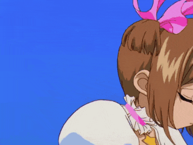 a girl with brown hair and green eyes is wearing a pink bow
