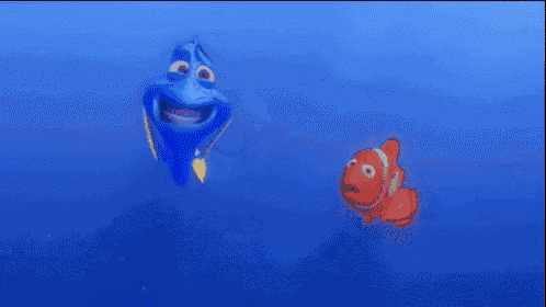 dory and clown fish are swimming in the ocean