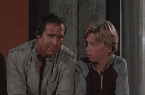 a man and a boy are sitting next to each other with the words " good talk son " above them