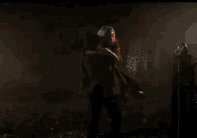 a man and a woman are kissing in the dark .