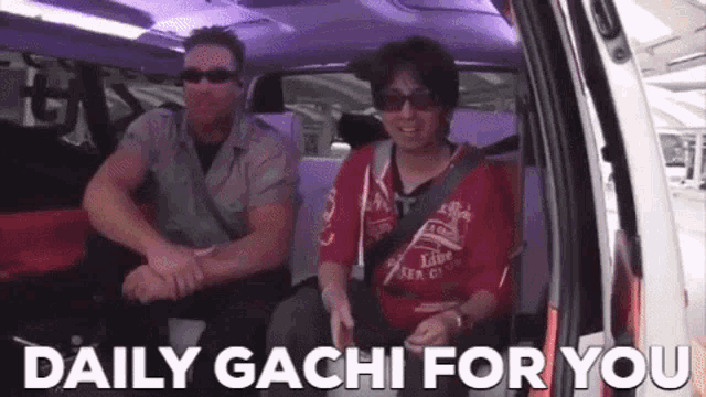 a man and a woman are sitting in the back seat of a car with the words daily gacha for you written on the screen .