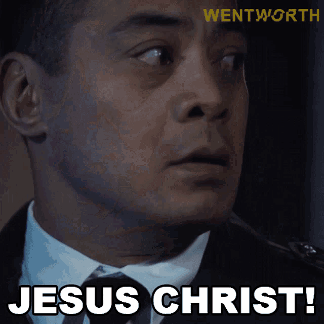 a close up of a man 's face with the words jesus christ on the bottom