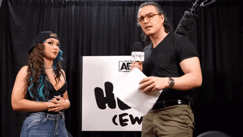 a man and a woman stand in front of a sign that says crew