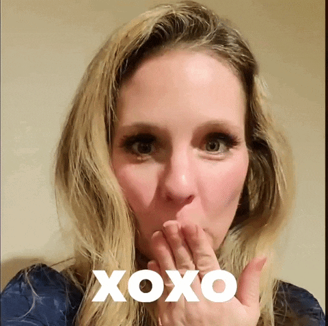 a woman is blowing a kiss with the word xoxo written on her face
