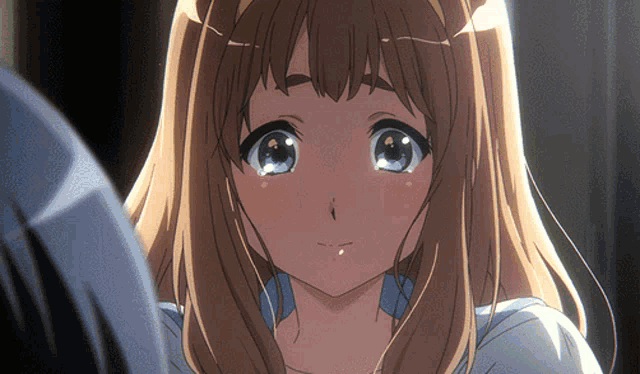 a close up of a girl 's face with her eyes closed