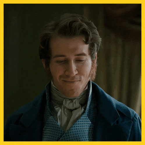 a man in a blue coat with the word very w on the bottom