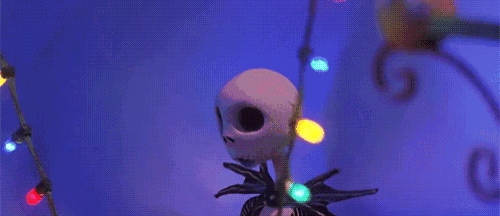 jack skellington from the nightmare before christmas has a string of christmas lights around his neck