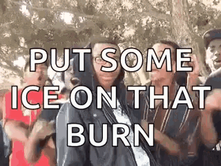 a group of people are standing in front of a tree with the words `` put some ice on that burn ''